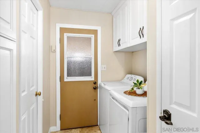 a bathroom with a sink and refrigerator