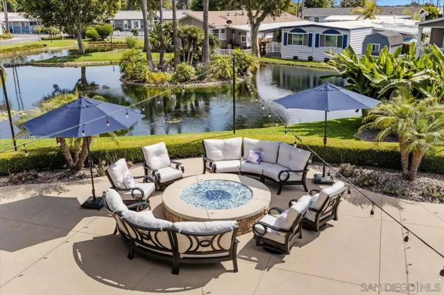 a view of a patio with couches table and chairs