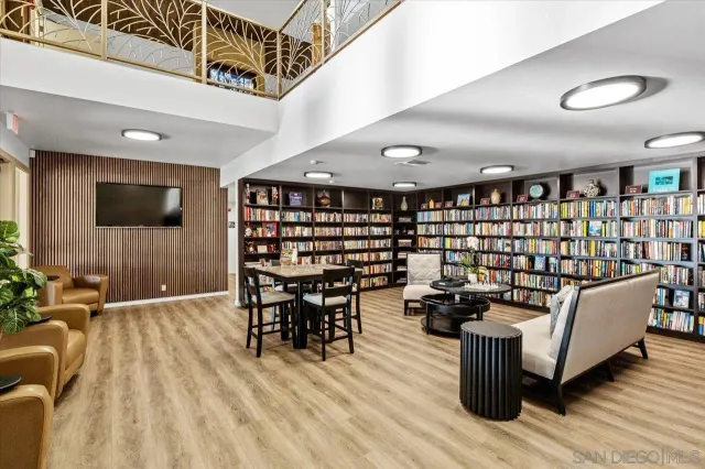 a reading room with furniture and book shelf