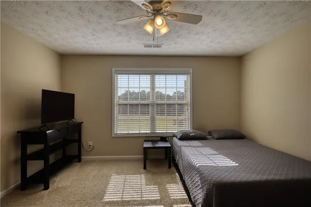 a bathroom with a toilet and shower