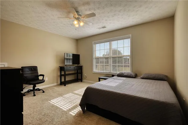 a bedroom with a bed and a cabinets