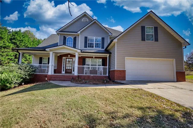 a front view of a house with a yard