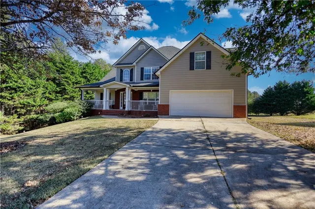 an aerial view of a house with swimming pool