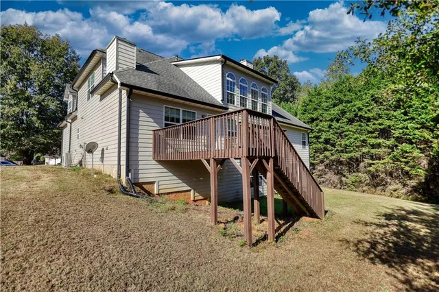 an aerial view of a house with a yard and garden