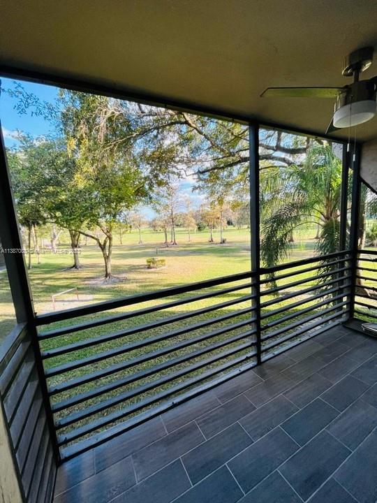 7950 West McNab Road, Unit 222 Tamarac, FL 33321 - Photo 15 of 35 a view of a room with wooden floor and windows