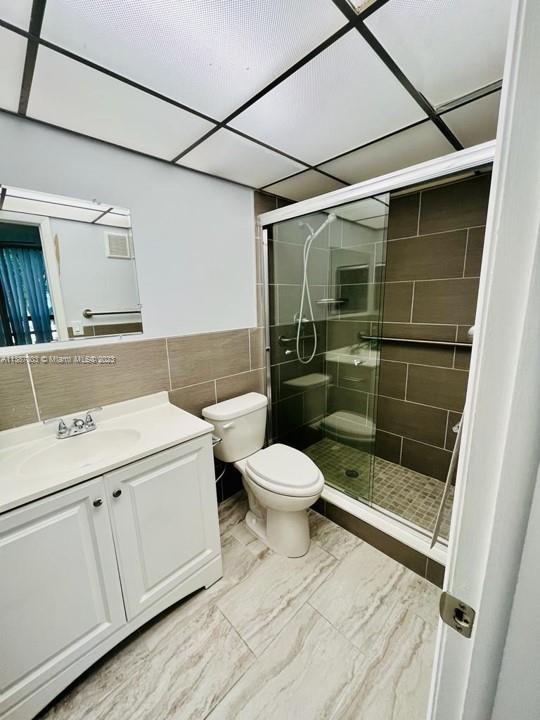 7950 West McNab Road, Unit 222 Tamarac, FL 33321 - Photo 20 of 35 a bathroom with a toilet a sink and shower