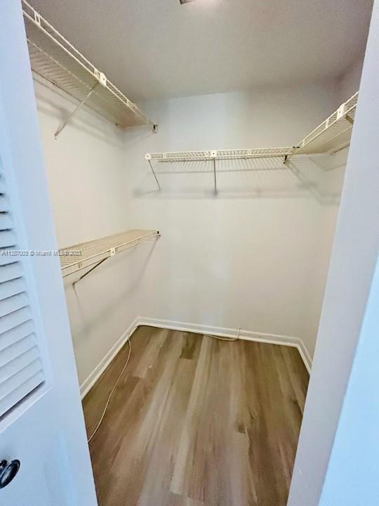 7950 West McNab Road, Unit 222 Tamarac, FL 33321 - Photo 21 of 35 a view of walk in closet with empty racks