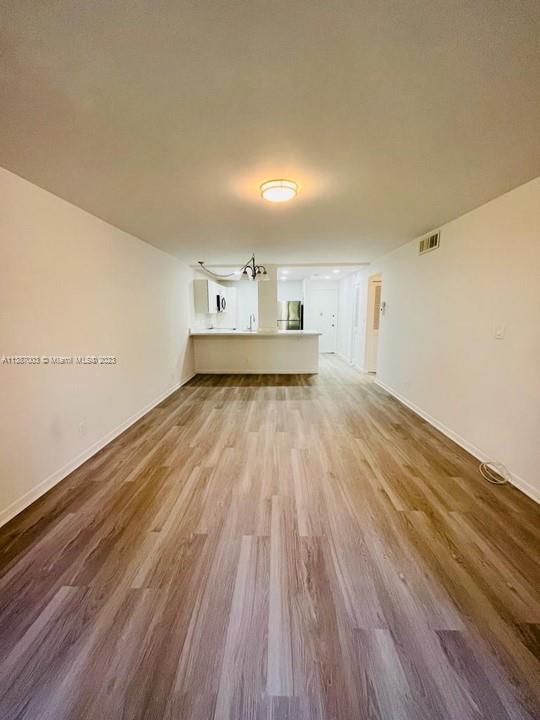 7950 West McNab Road, Unit 222 Tamarac, FL 33321 - Photo 22 of 35 a view of a room with wooden floor