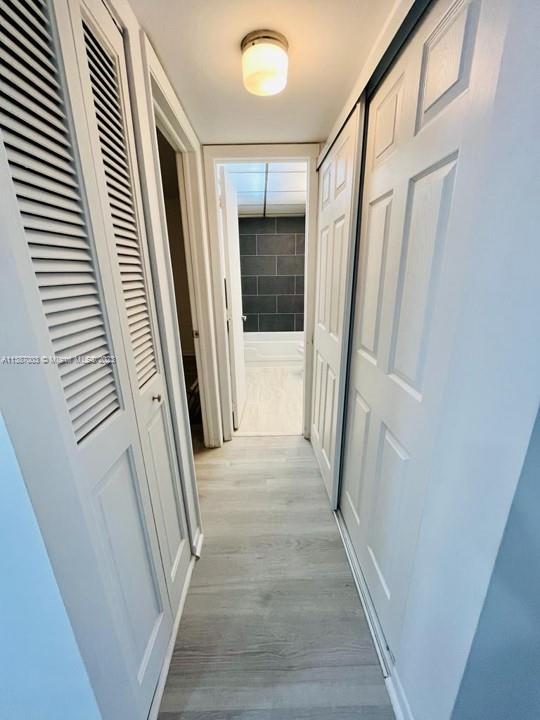 7950 West McNab Road, Unit 222 Tamarac, FL 33321 - Photo 23 of 35 a view of a hallway with wooden floor and staircase