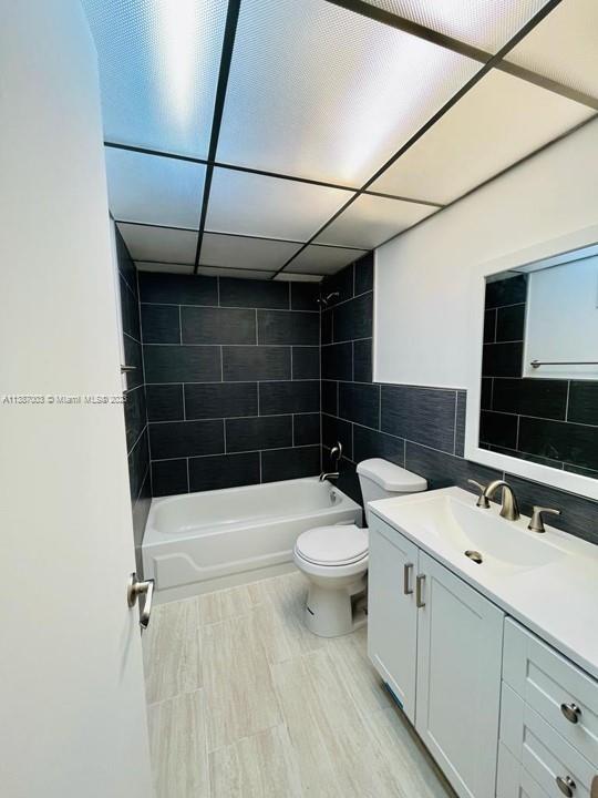 7950 West McNab Road, Unit 222 Tamarac, FL 33321 - Photo 24 of 35 a bathroom with a sink a toilet a mirror and shower