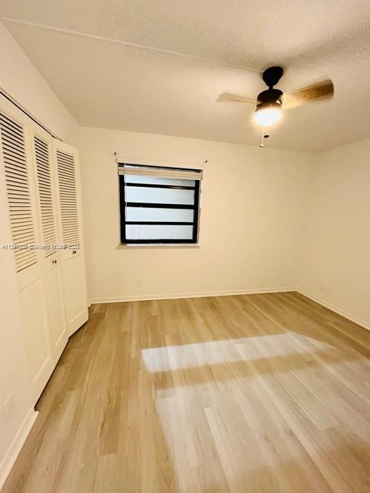 7950 West McNab Road, Unit 222 Tamarac, FL 33321 - Photo 25 of 35 a view of empty room with wooden floor