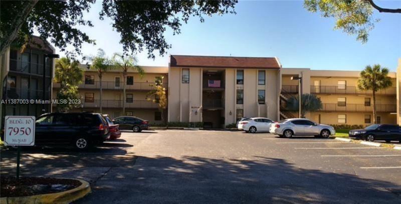 7950 West McNab Road, Unit 222 Tamarac, FL 33321 - Photo 3 of 35 a car parked in front of a building