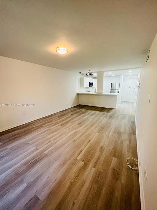 7950 West McNab Road, Unit 222 Tamarac, FL 33321 - Photo 7 of 35 a view of a livingroom with wooden floor