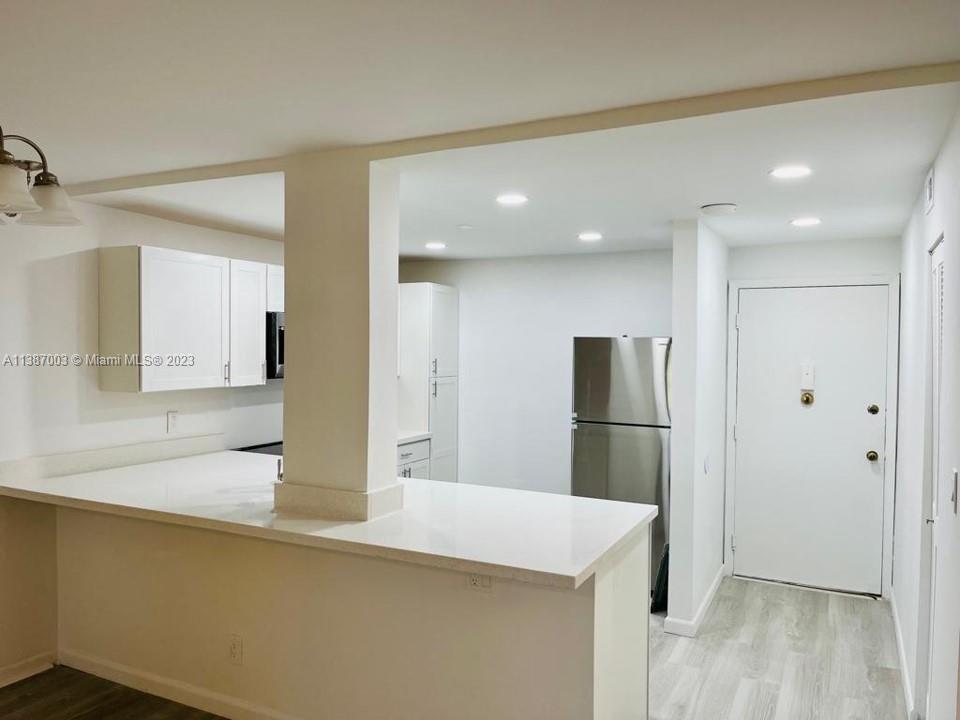 7950 West McNab Road, Unit 222 Tamarac, FL 33321 - Photo 10 of 35 a kitchen with stainless steel appliances a refrigerator and a sink