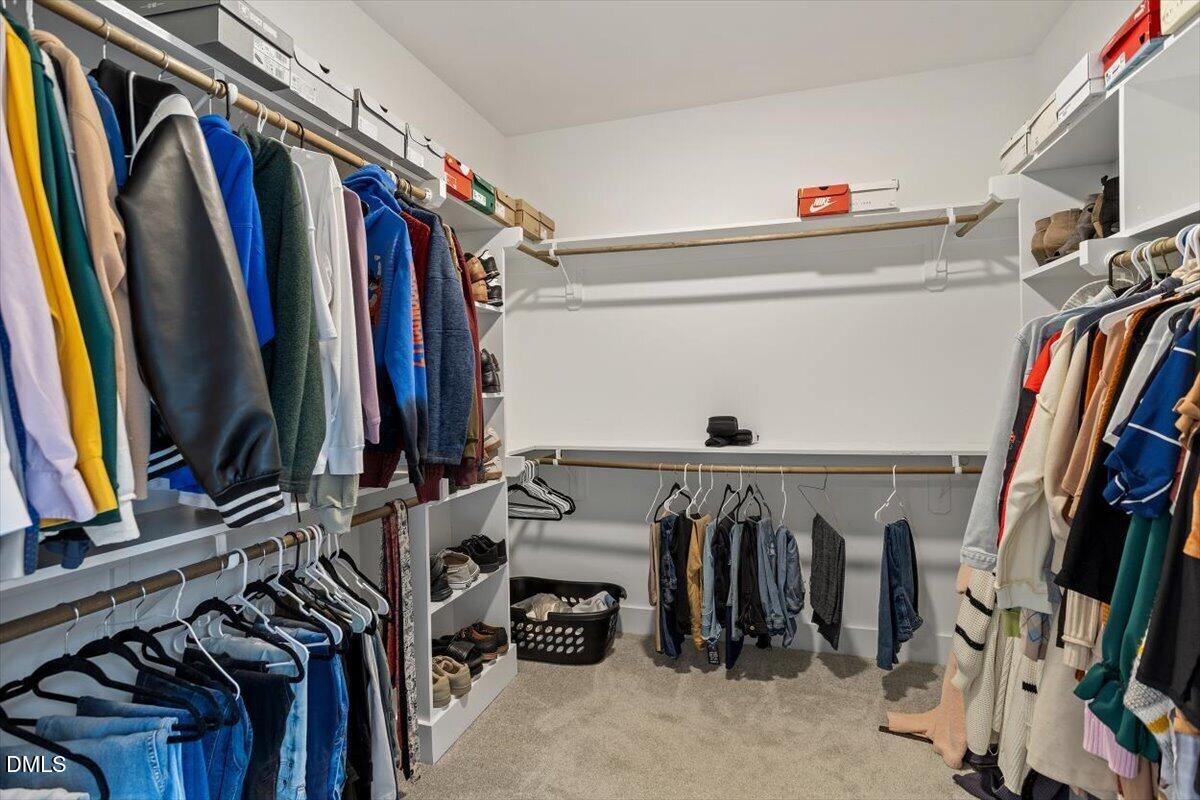2810 Antioch Church Road Timberlake, NC 27583 - Photo 28 of 34 a view of walk in closet with clothes and shoes