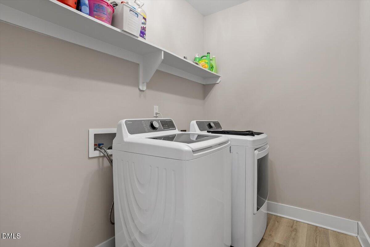 2810 Antioch Church Road Timberlake, NC 27583 - Photo 29 of 34 a utility room with dryer and washer
