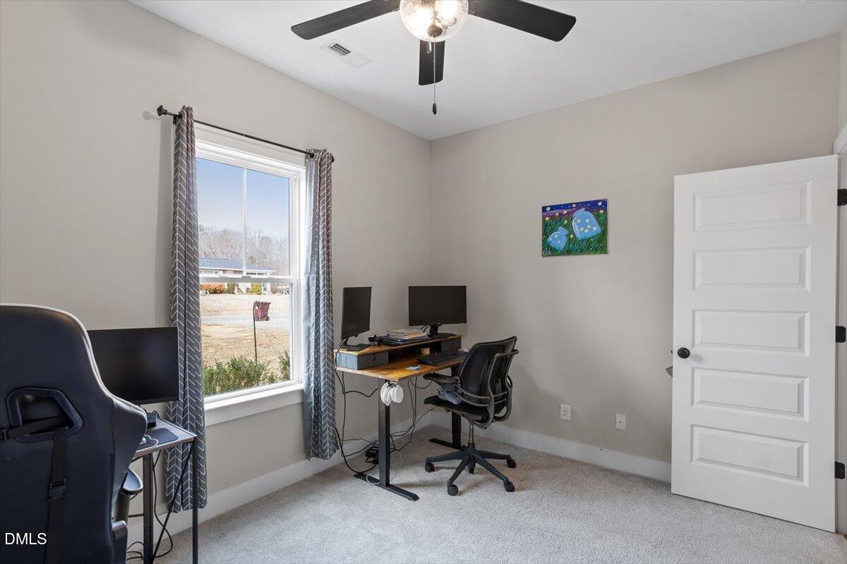 2810 Antioch Church Road Timberlake, NC 27583 - Photo 31 of 34 a view of a workspace with furniture and a window