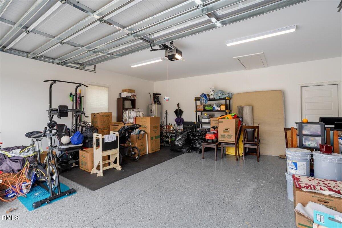 2810 Antioch Church Road Timberlake, NC 27583 - Photo 33 of 34 a view of a garage with a bike and car