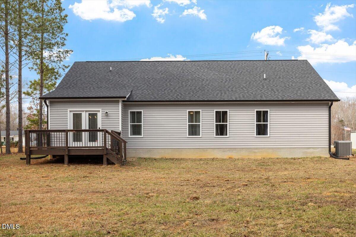 2810 Antioch Church Road Timberlake, NC 27583 - Photo 5 of 34 a front view of a house with a garden