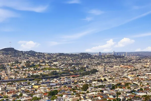 an aerial view of residential building with green space