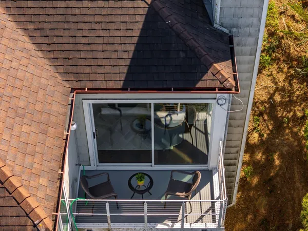 a kitchen with stainless steel appliances a refrigerator sink and white cabinets