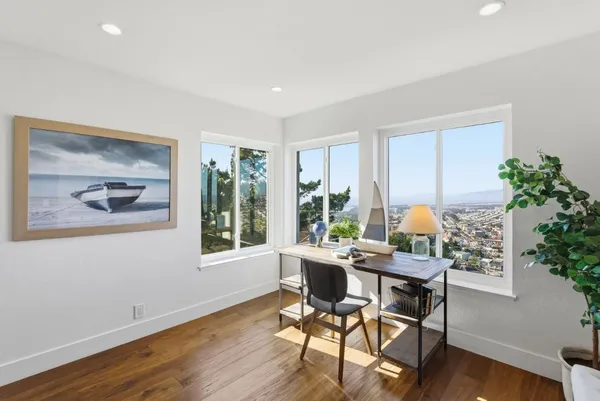 a kitchen with stainless steel appliances a stove a sink a microwave and cabinets