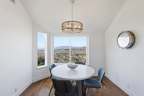 a bedroom with a bed and a night stand