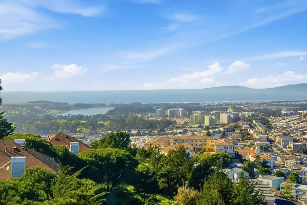 a bathroom with a shower tub double vanity and a mirror