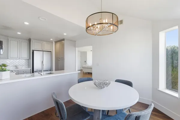 a bathroom with a double vanity sink a mirror and a shower
