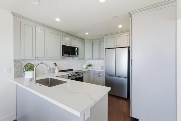 a view of room that has a white walls