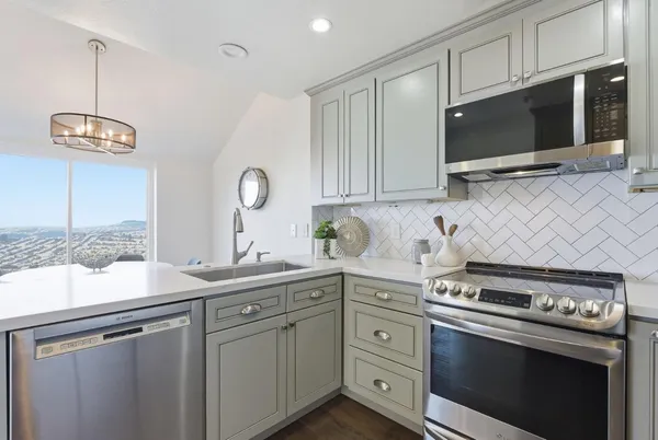 a white building with trees in front of it