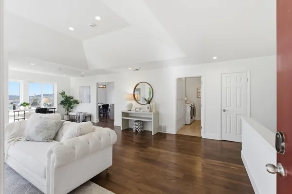 a living room with furniture couches and a fireplace