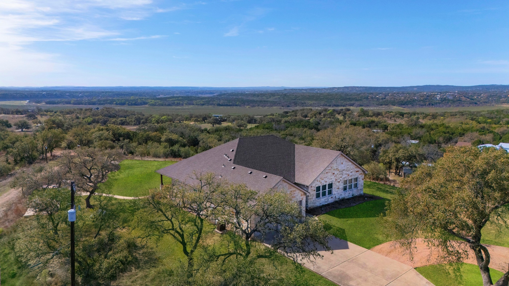28701 Valley Road Marble Falls, TX 78654 - Photo 6 of 35 an aerial view of a house with a garden