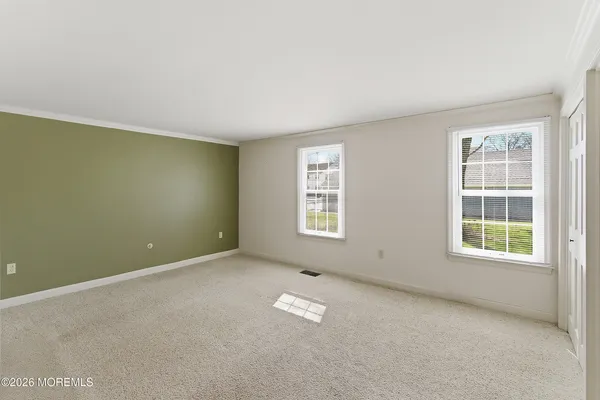 an empty room with a empty space and a window