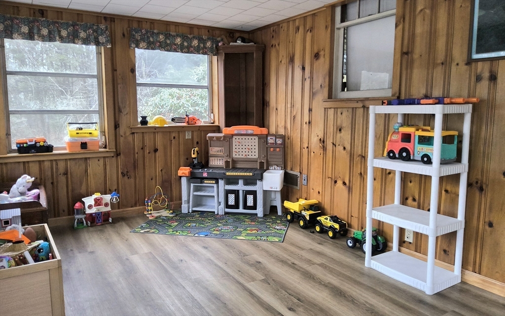 323 New Boston Road Sturbridge, MA 01566 - Photo 13 of 37 a room with furniture and a wooden floor