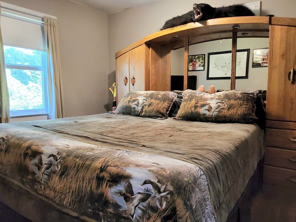 323 New Boston Road Sturbridge, MA 01566 - Photo 16 of 37 a bedroom with a bed and a window