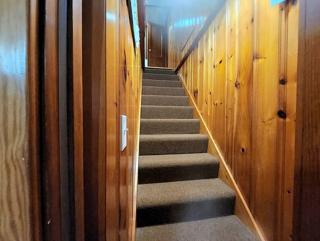 323 New Boston Road Sturbridge, MA 01566 - Photo 20 of 37 a view of staircase with wooden floor and stairs