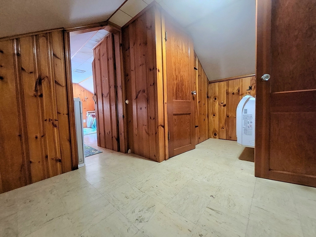 323 New Boston Road Sturbridge, MA 01566 - Photo 21 of 37 a view of a closet with wooden walls
