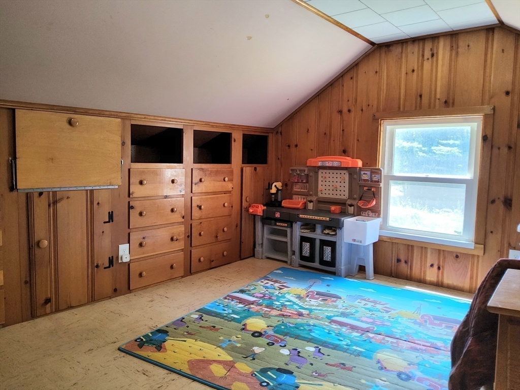 323 New Boston Road Sturbridge, MA 01566 - Photo 24 of 37 a living room with furniture and a flat screen tv