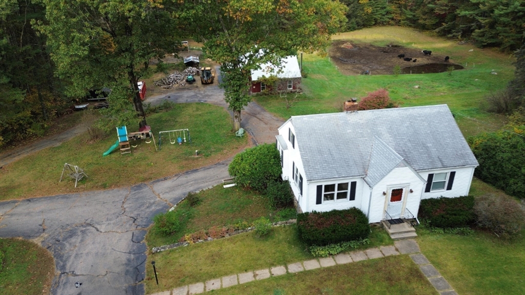 323 New Boston Road Sturbridge, MA 01566 - Photo 35 of 37 an aerial view of a house with a yard