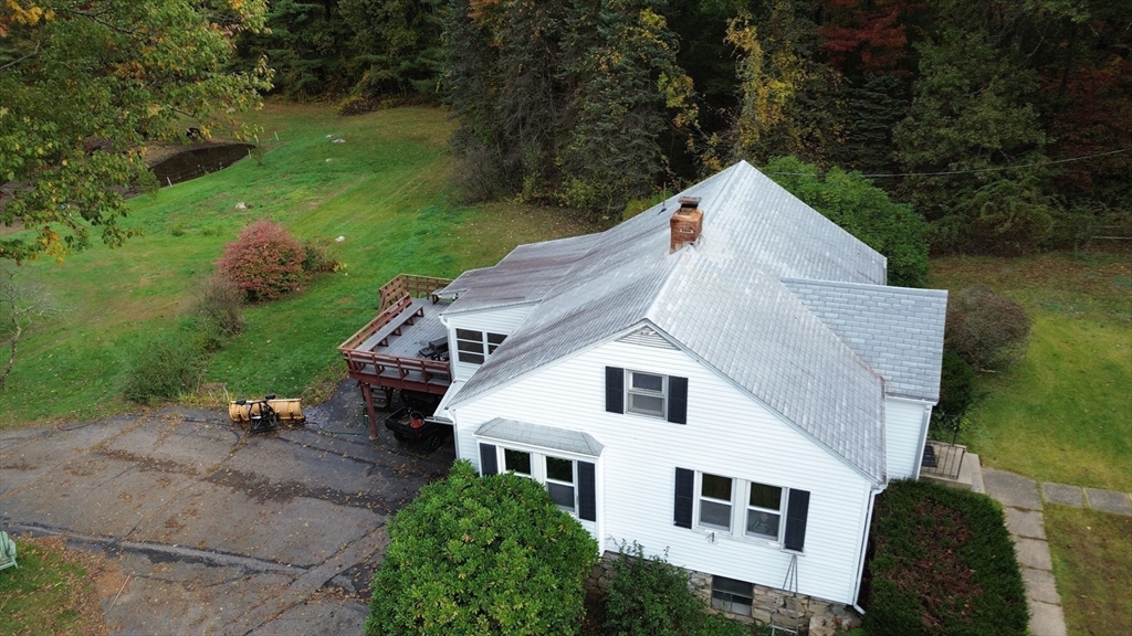 323 New Boston Road Sturbridge, MA 01566 - Photo 36 of 37 a view of a house with a yard