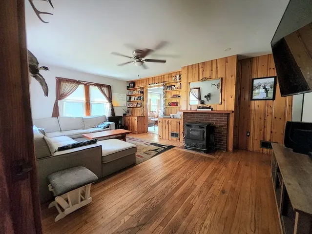a view of a livingroom with furniture and a potted plant