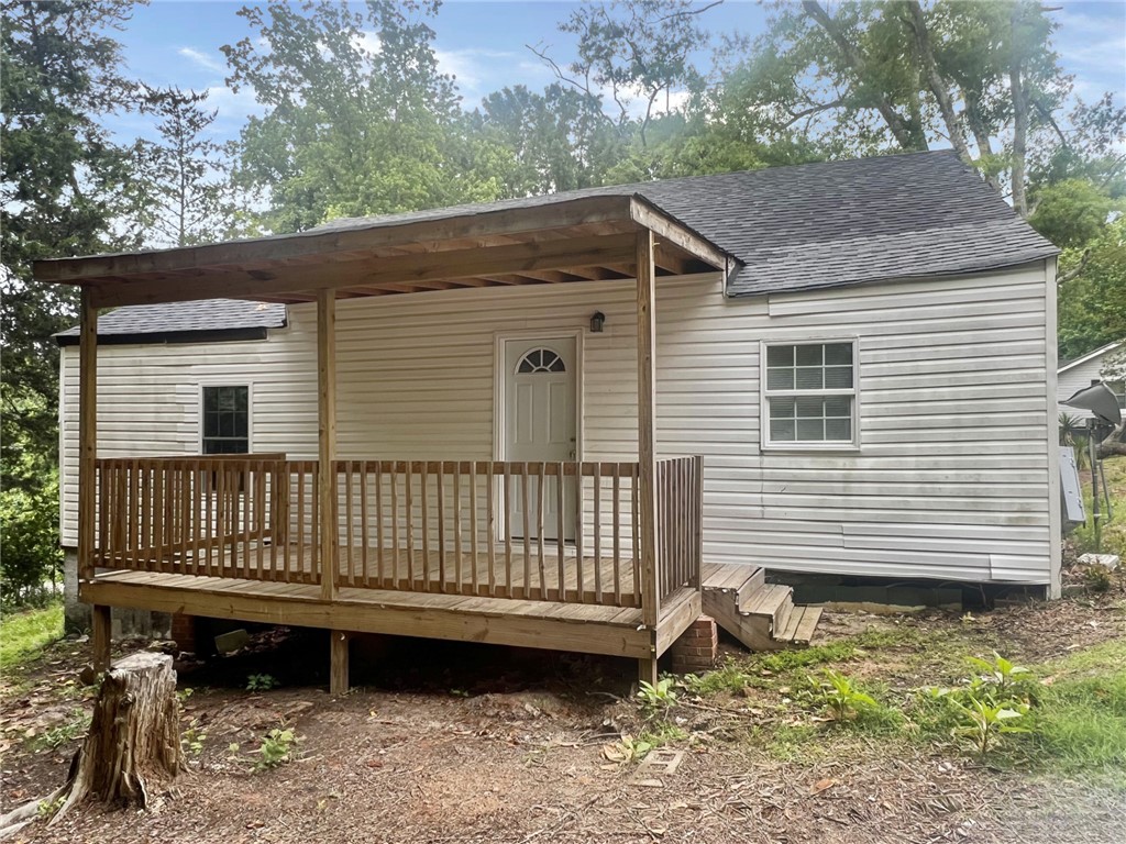 301 Hammett Street Honea Path, SC 29654 - Photo 11 of 14 A charming compact home features a welcoming covered porch, perfect for enjoying peaceful outdoor moments.