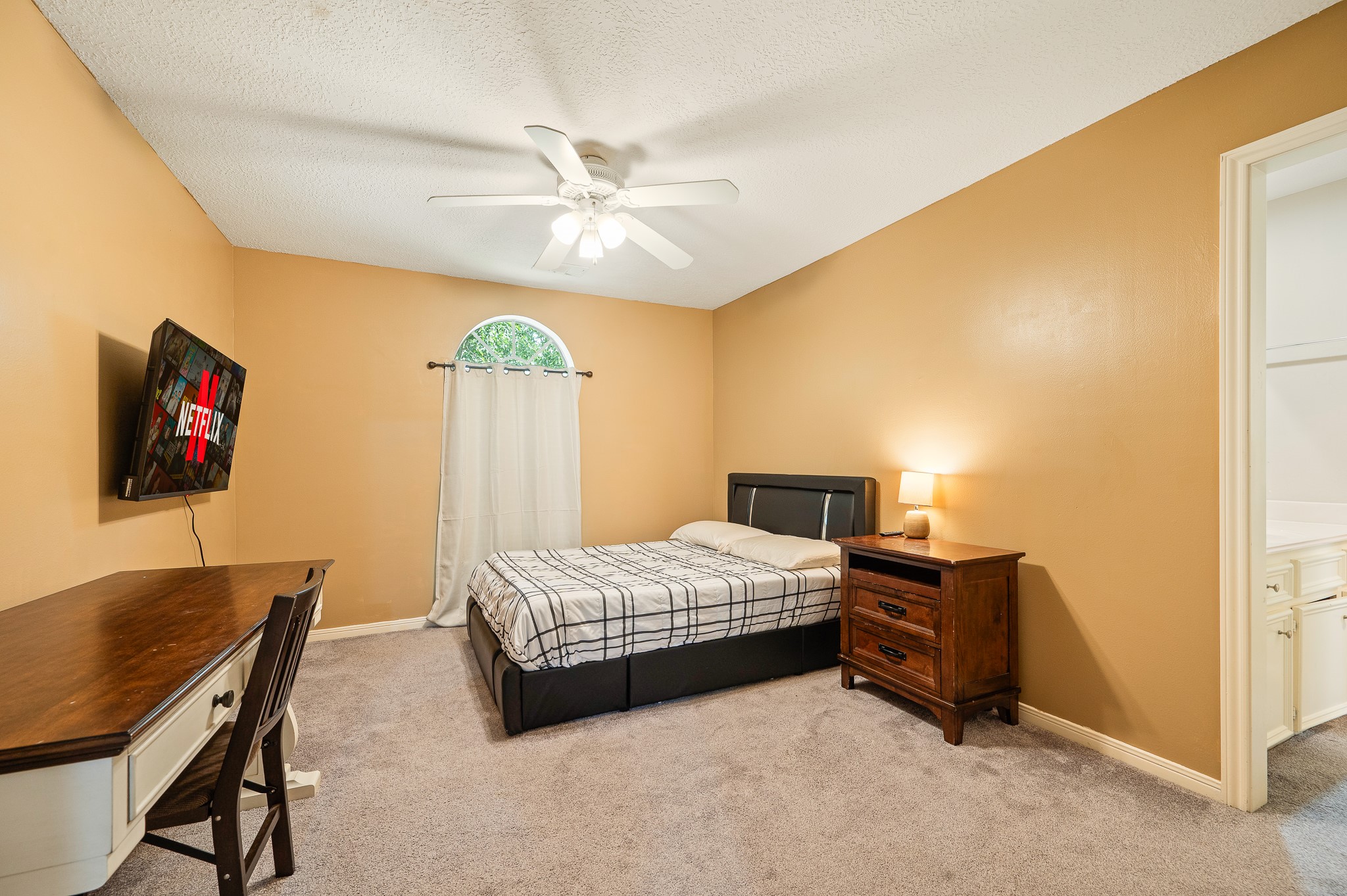 8111 Morningbrook Court Spring, TX 77379 - Photo 32 of 46 a bedroom with a bed and a desk