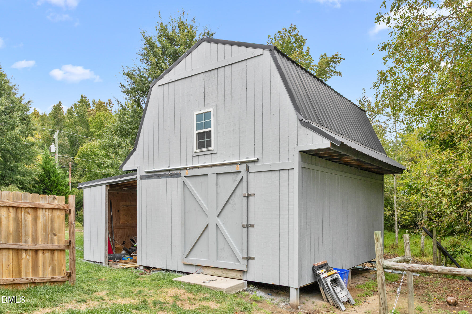 3163 Saul Loop Road Elon, NC 27244 - Photo 39 of 44 a view of a house with backyard and garage