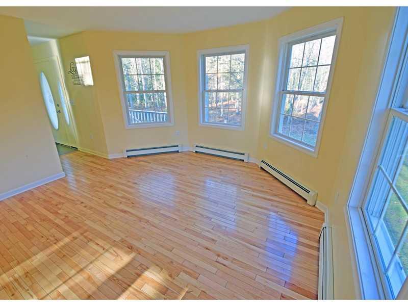 642 Oak Point Road Trenton, ME 04605 - Photo 20 of 35 The Living Room has triple bay...