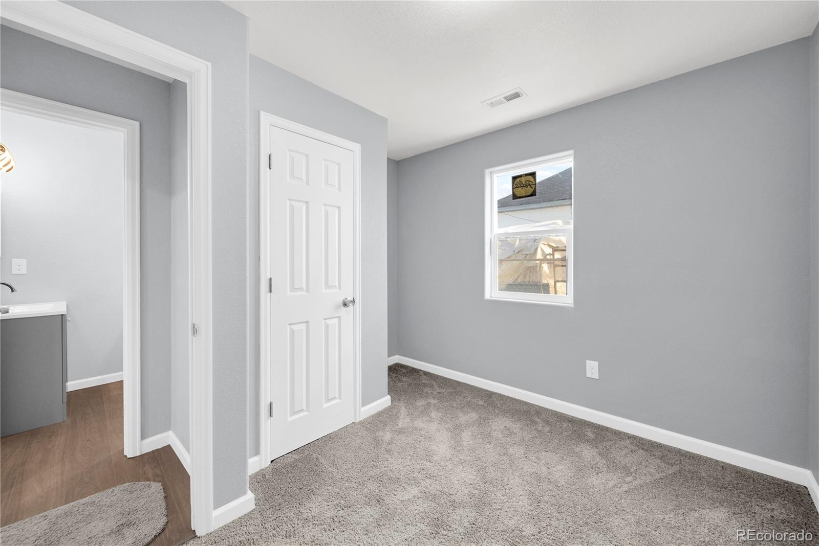 222 Platte Street Sterling, CO 80751 - Photo 12 of 24 an empty room with windows and closet