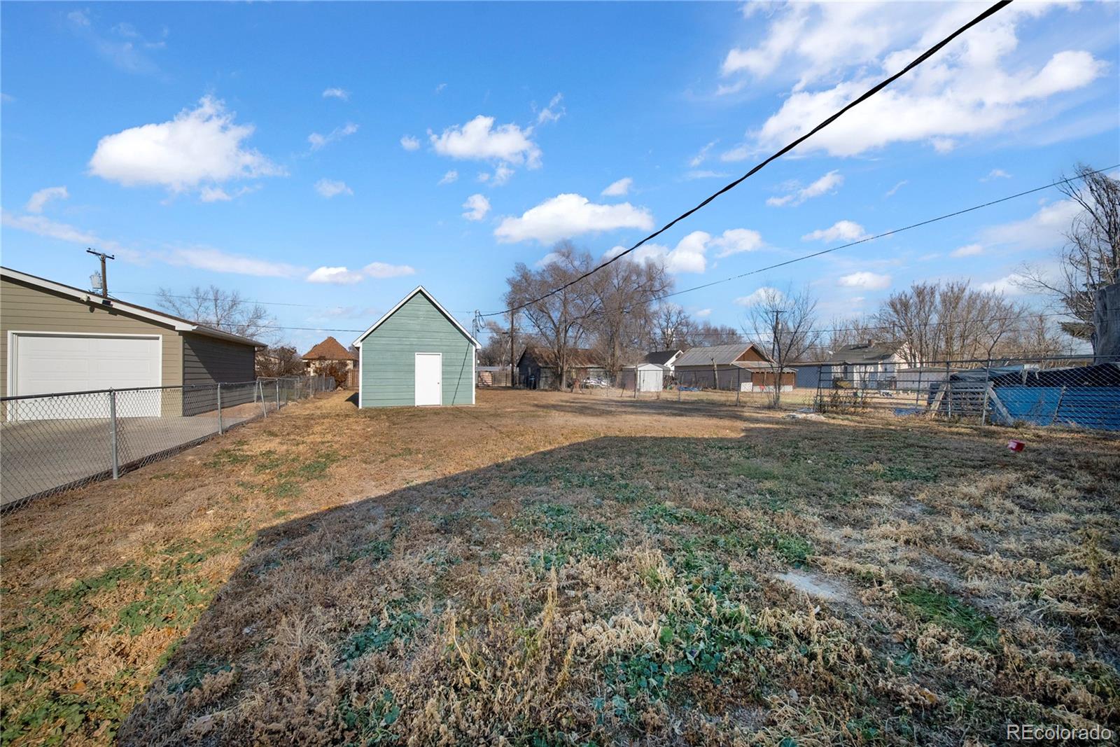 222 Platte Street Sterling, CO 80751 - Photo 19 of 24 a view of a house with a yard