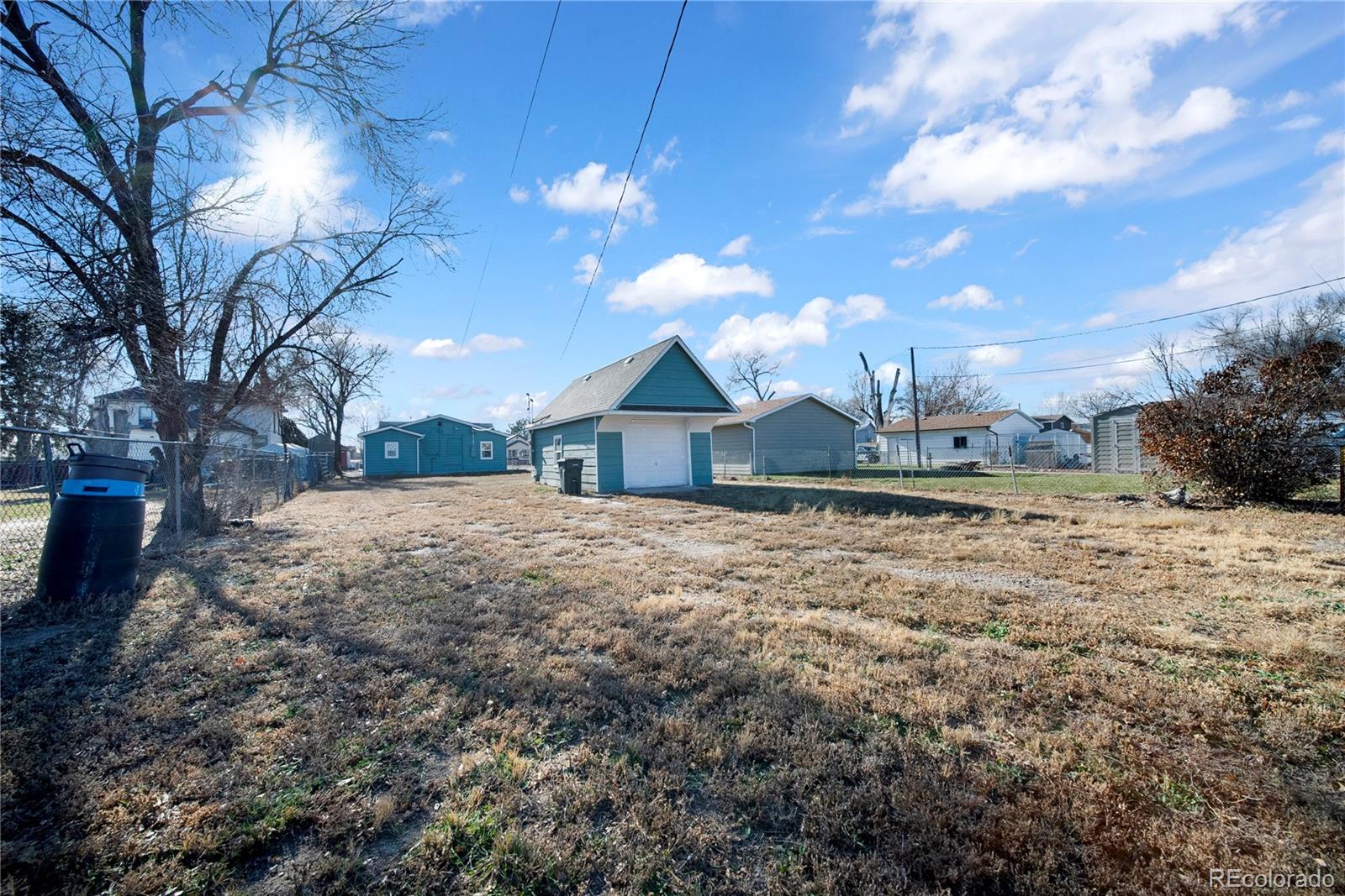 222 Platte Street Sterling, CO 80751 - Photo 21 of 24 a view of house with yard and car parked
