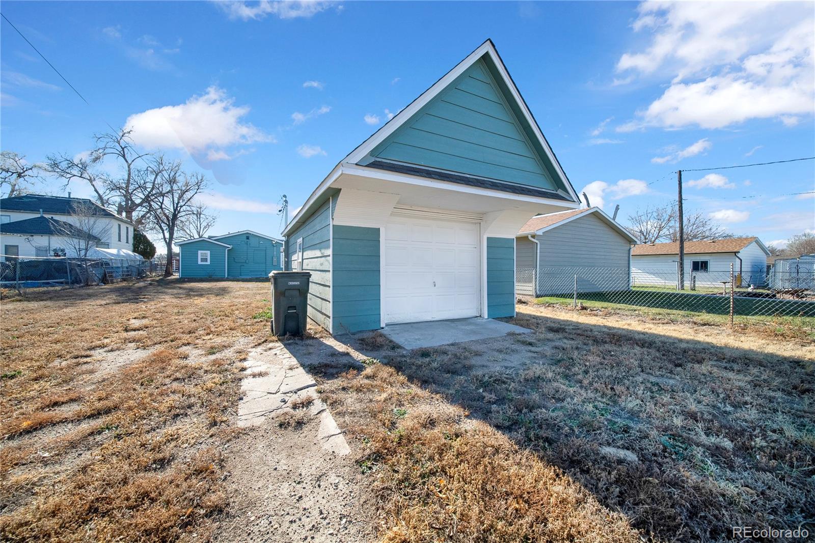 222 Platte Street Sterling, CO 80751 - Photo 22 of 24 a view of a house with a yard